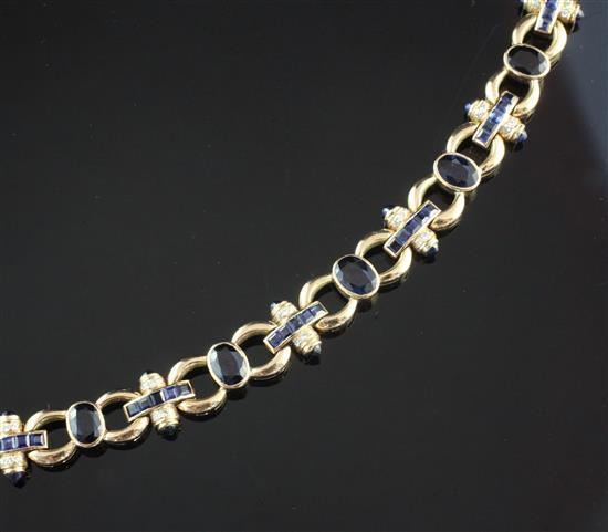 An Indian 14ct gold, sapphire and diamond circular and baton link bracelet, 7.75in.